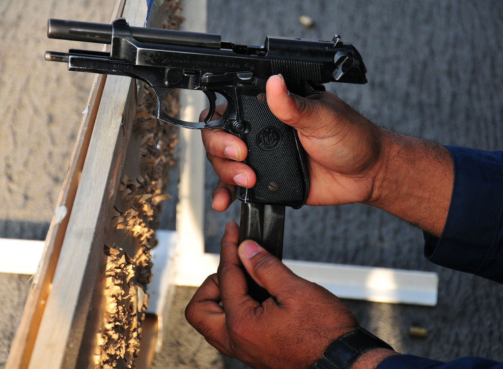 Handguns and rifles in Baghdad market as Iraq's gun control come into force